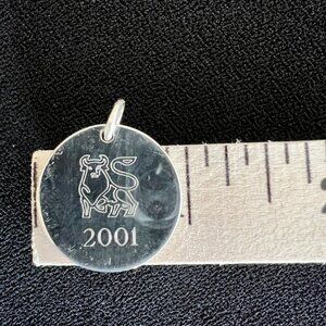 Vintage Merrill Lynch by Tiffany & Co 925 Silver Charm w Iconic Bull and year